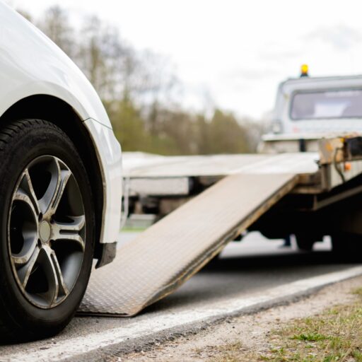 Loading Broken Car On A Tow Truck On A Roadside